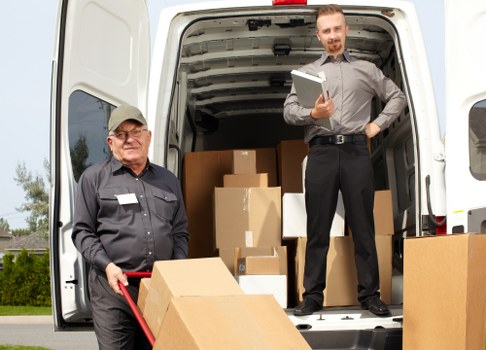 Van crew loading recyclable moving materials in Winchmore Hill