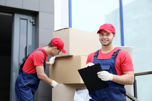 Professional movers handling furniture with care