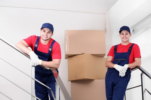 Office desks and storage items arranged for a business move