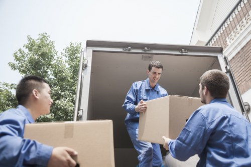 Local office removal team handling furniture and boxes near Winchmore Hill