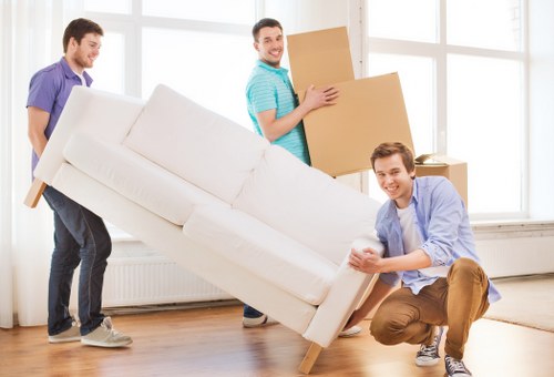 Loading furniture into a moving van for a local relocation