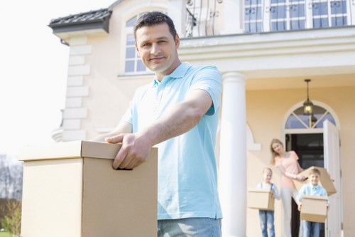 Moving service handling household items in a Winchmore Hill home