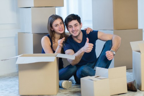 Packers preparing household items for a move in Winchmore Hill