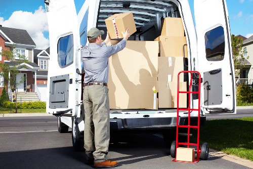 Van mover with gloves and safety equipment handling furniture