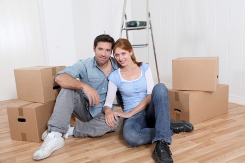 Professional movers loading household items in Winchmore Hill