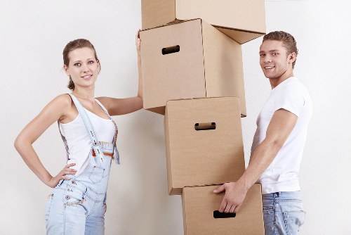 Loading furniture into a removals van in a residential North London street